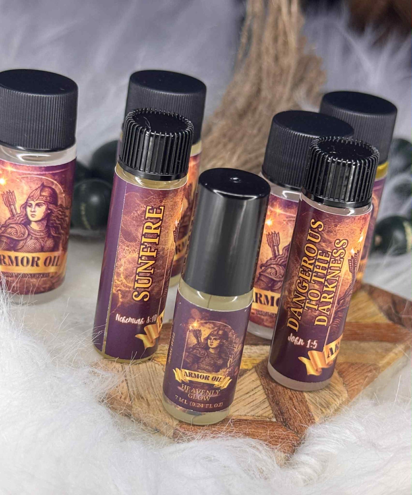 Collection of Armor Oil bottles with labels on a textured surface